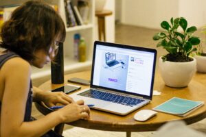 Person designing website on laptop